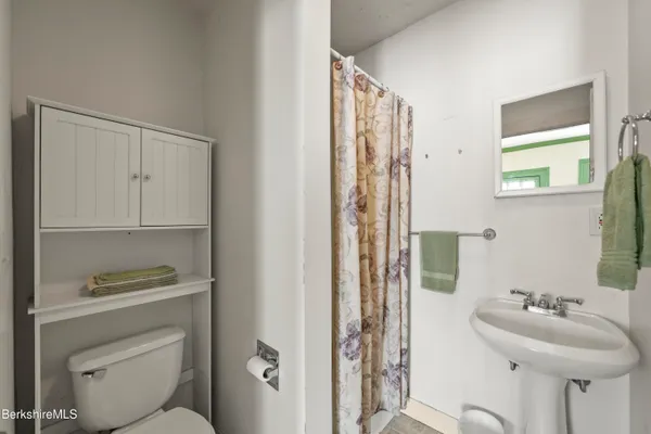 a bedroom with a bed and a table