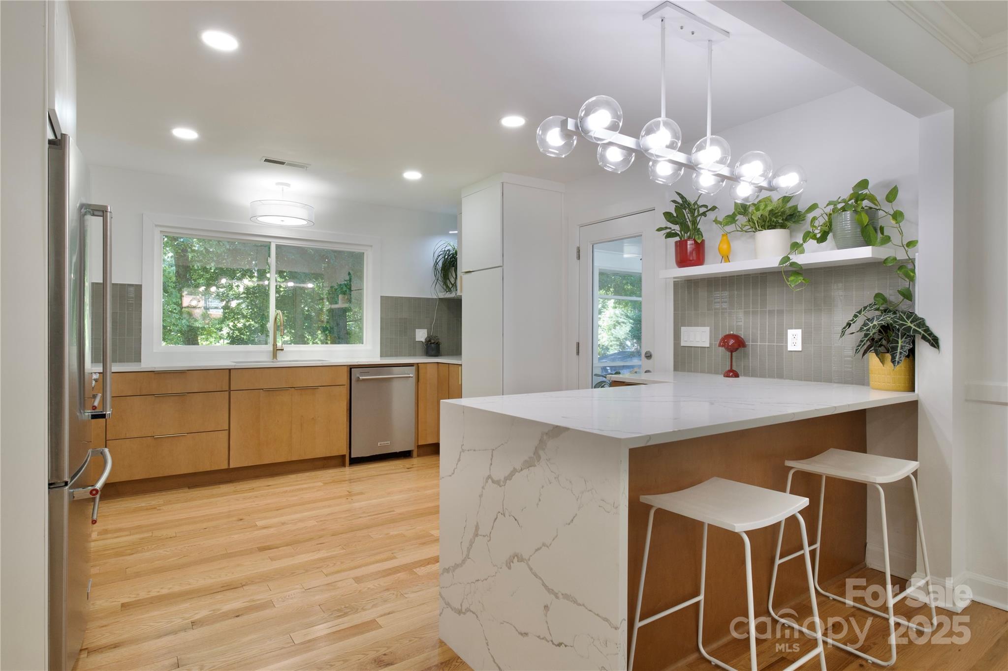 3549 Woodleaf Road Charlotte, NC 28205 - Photo 11 of 43 a kitchen with a table and chairs in it