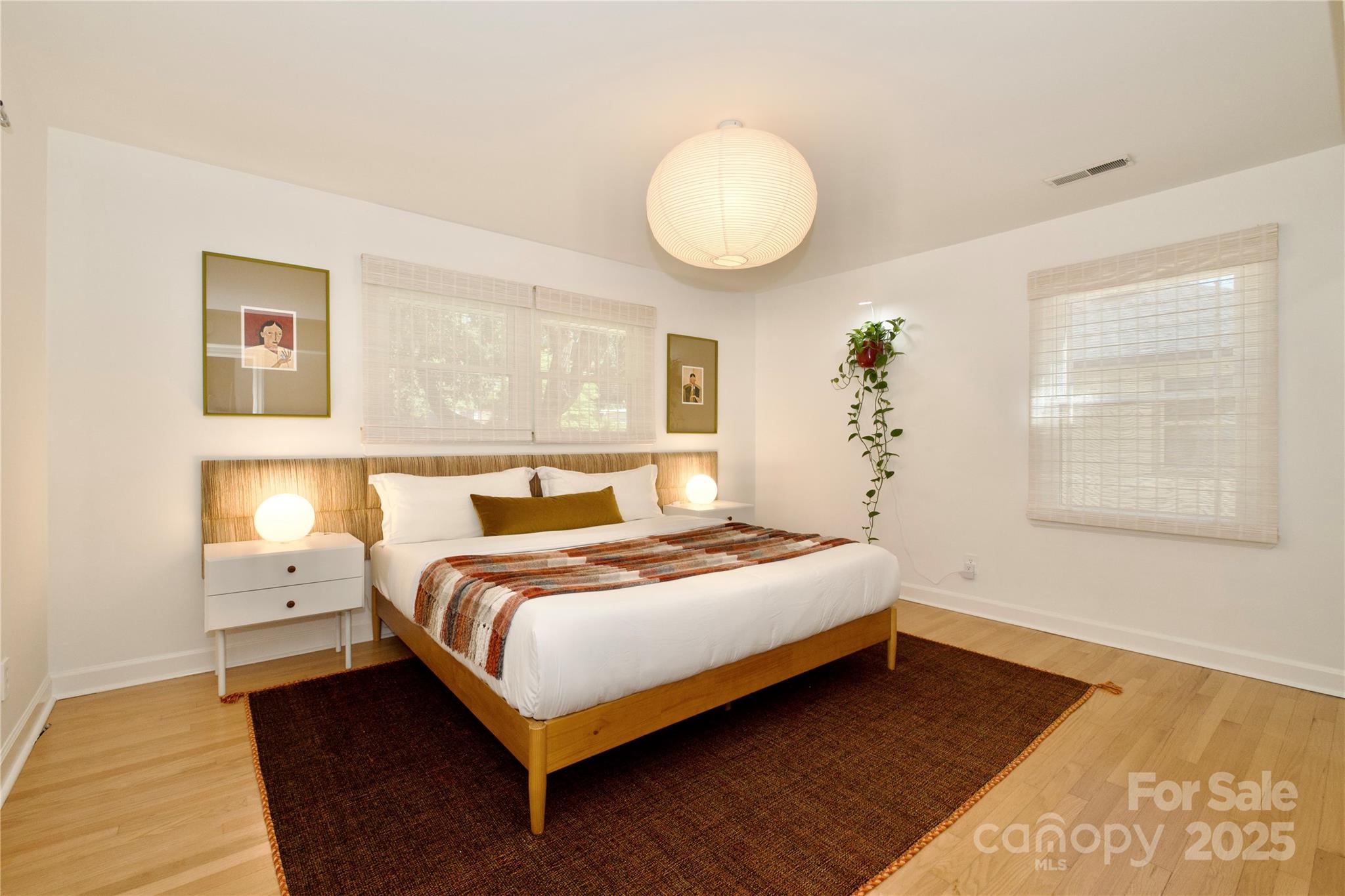 3549 Woodleaf Road Charlotte, NC 28205 - Photo 17 of 43 a bedroom with a bed and window