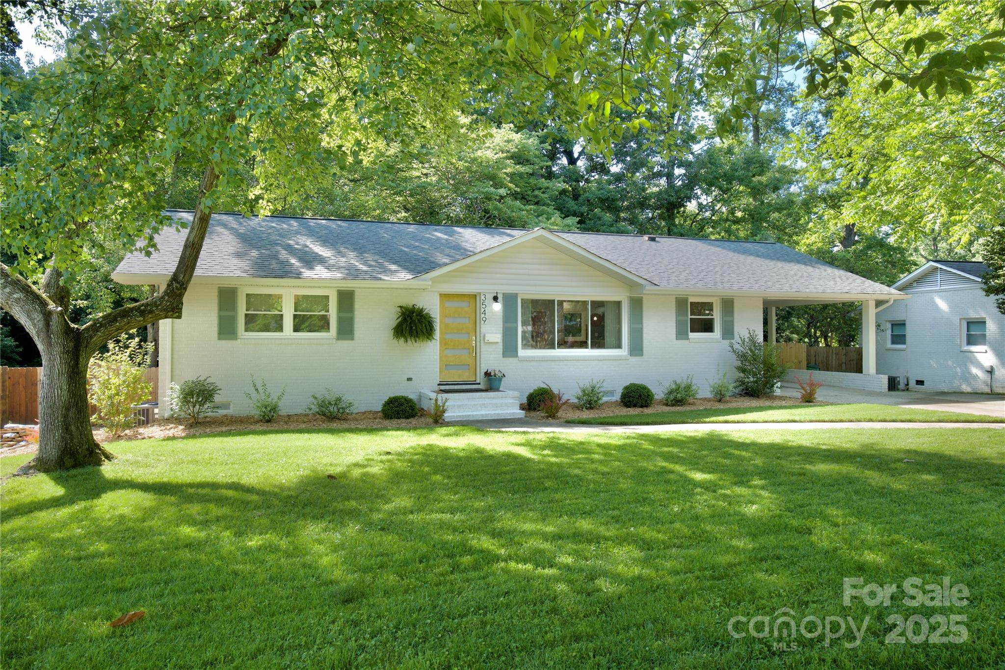 3549 Woodleaf Road Charlotte, NC 28205 - Photo 2 of 43 a front view of a house with a garden
