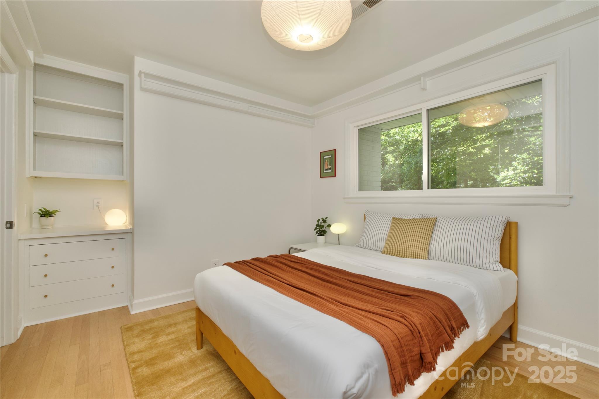 3549 Woodleaf Road Charlotte, NC 28205 - Photo 25 of 43 a bedroom with a bed and a window