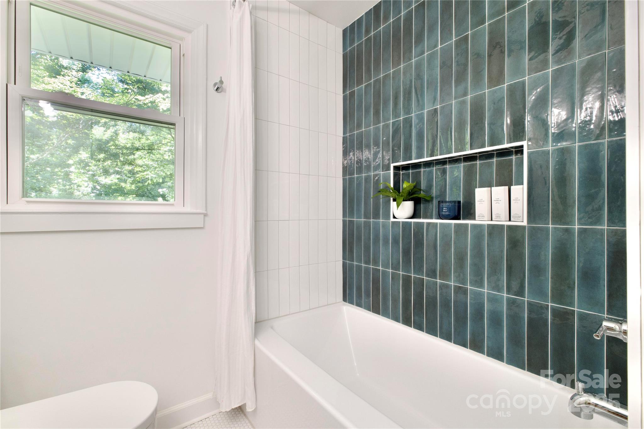 3549 Woodleaf Road Charlotte, NC 28205 - Photo 28 of 43 a bathroom with a toilet and shower