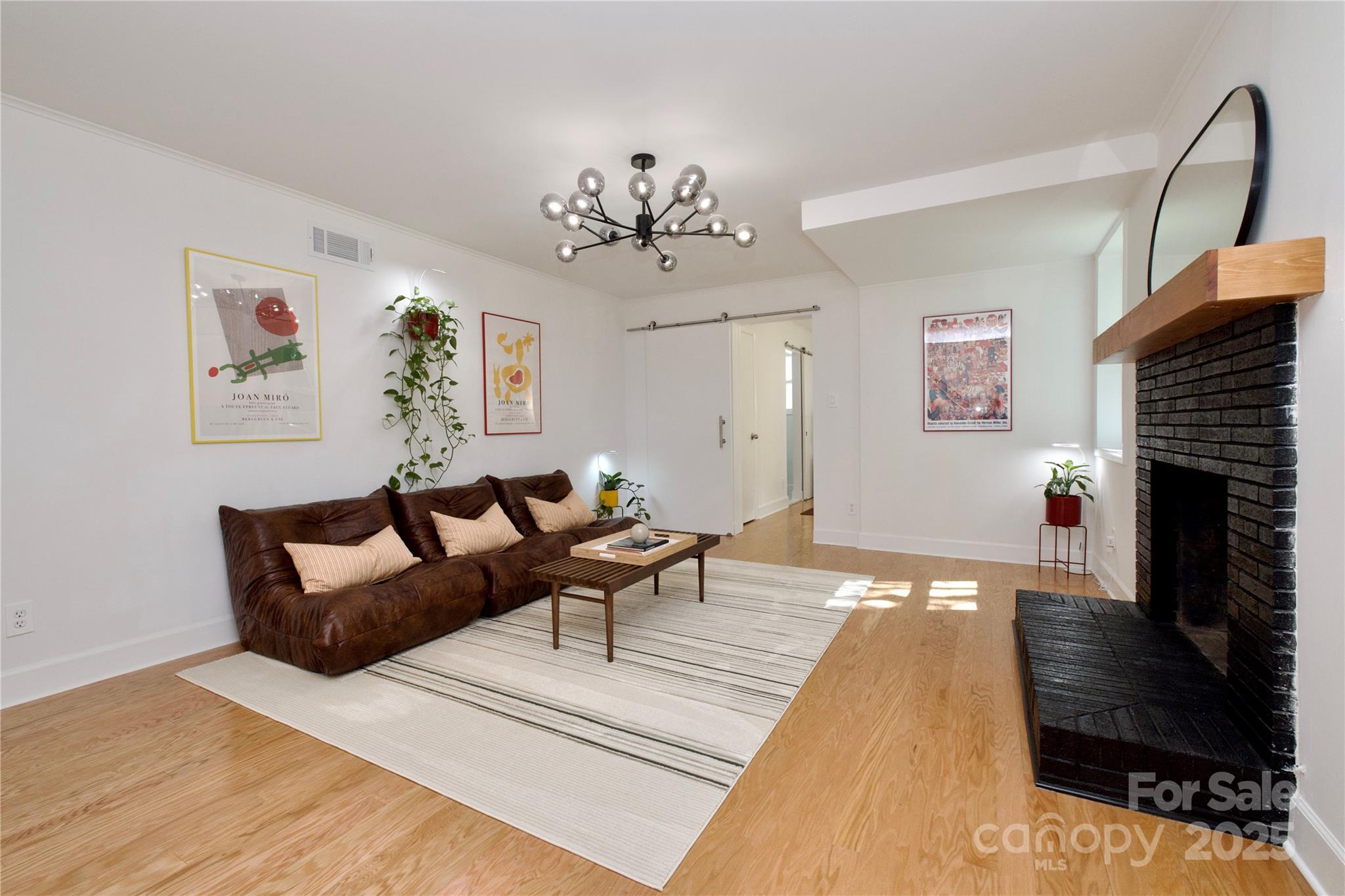 3549 Woodleaf Road Charlotte, NC 28205 - Photo 31 of 43 a living room with furniture and a fireplace