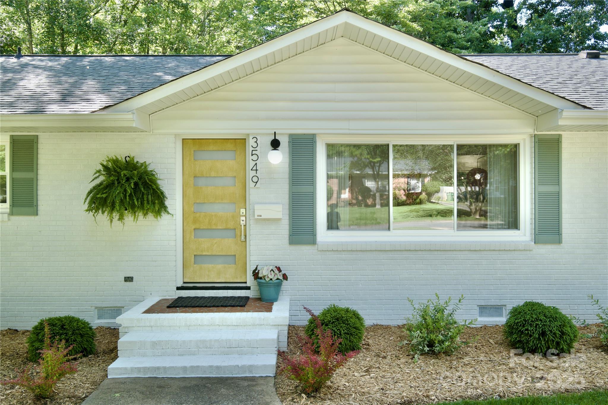 3549 Woodleaf Road Charlotte, NC 28205 - Photo 4 of 43 a front view of a house with a yard