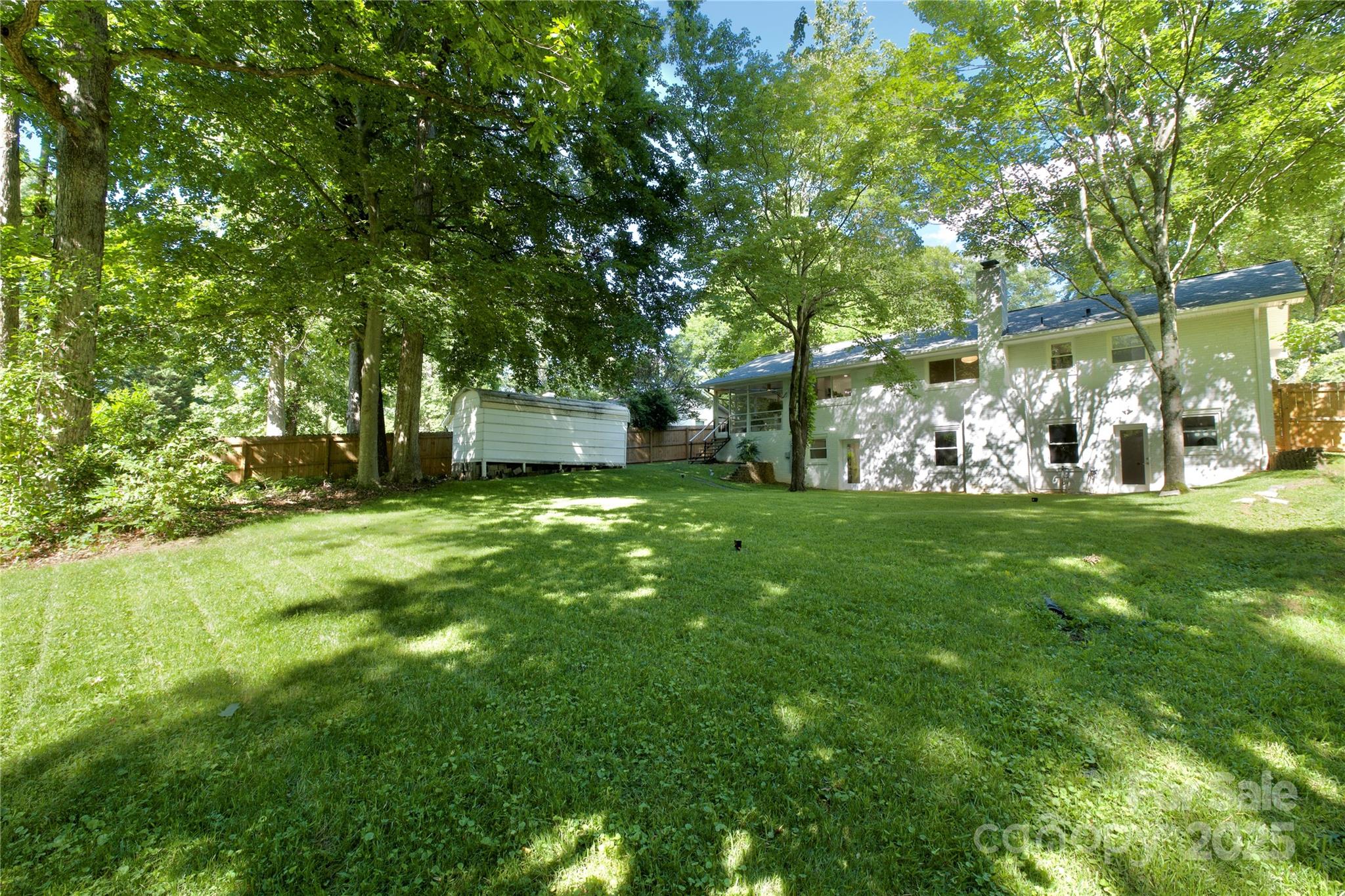 3549 Woodleaf Road Charlotte, NC 28205 - Photo 42 of 43 a view of a tree in front of a house