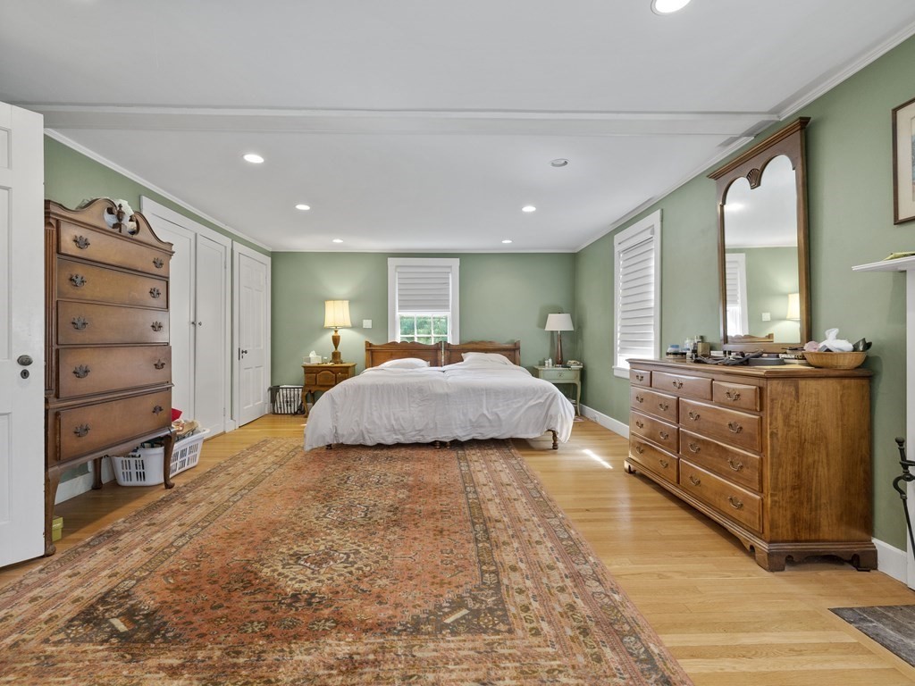 14 Birch Road Wellesley, MA 02482 - Photo 11 of 18 a large bedroom with a bed and large mirror