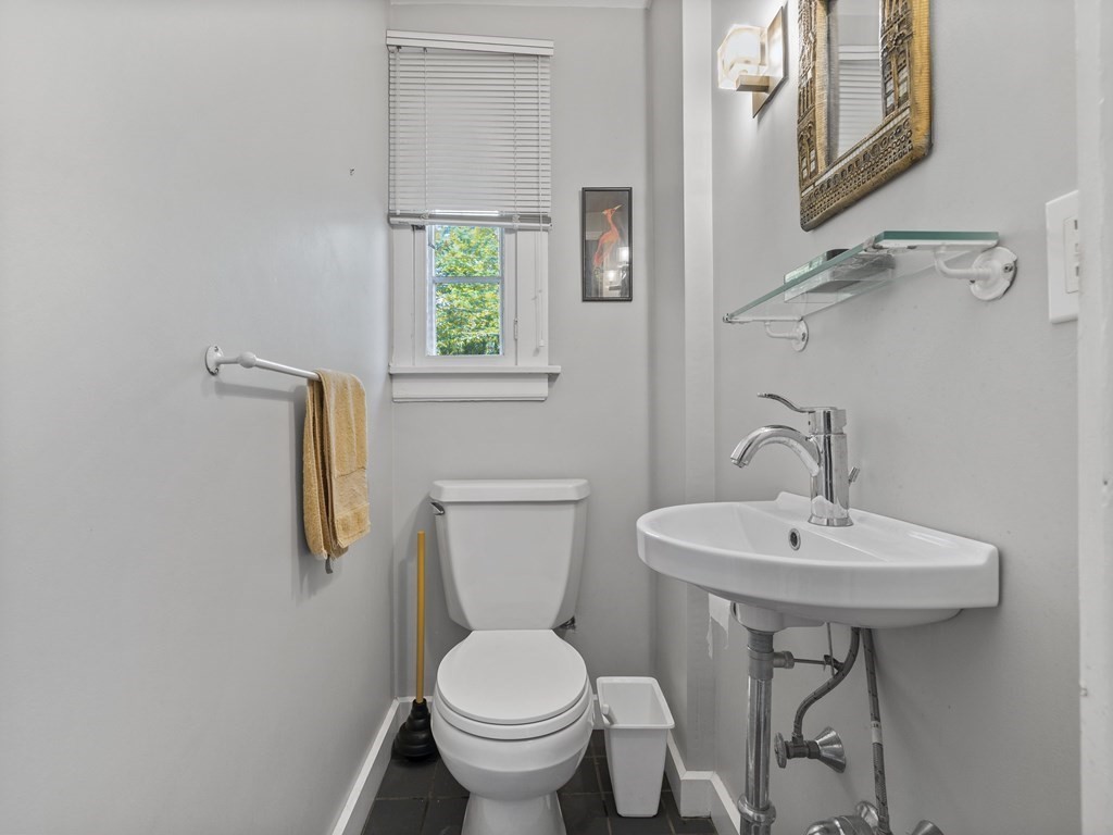 14 Birch Road Wellesley, MA 02482 - Photo 14 of 18 a bathroom with a toilet sink and mirror
