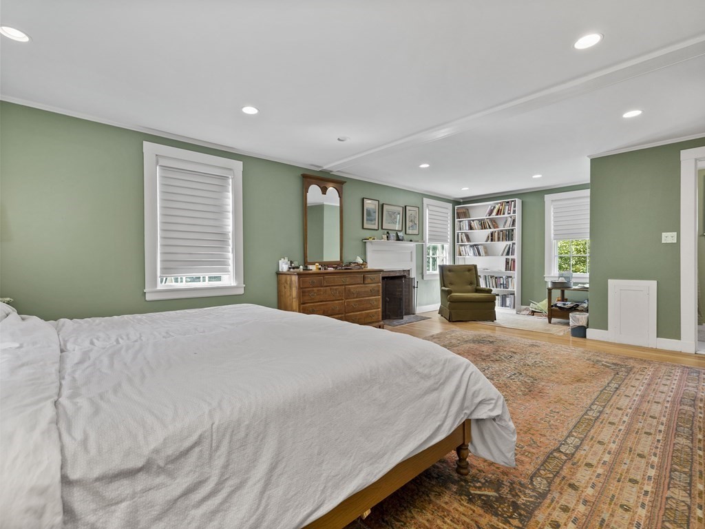 14 Birch Road Wellesley, MA 02482 - Photo 10 of 18 a bedroom with a large bed and large windows