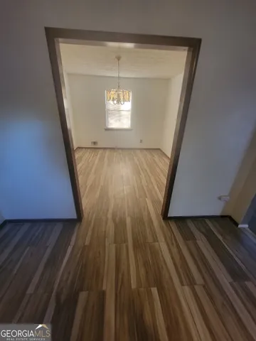 a view of wooden floor in an empty room