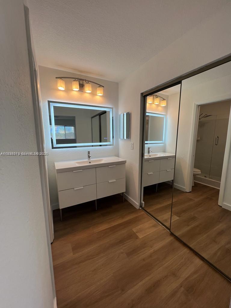9727 Hammocks Boulevard, Unit 202D Miami, FL 33196 - Photo 10 of 16 a view of living room with furniture and flat screen tv