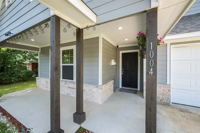 a front view of a house with a porch
