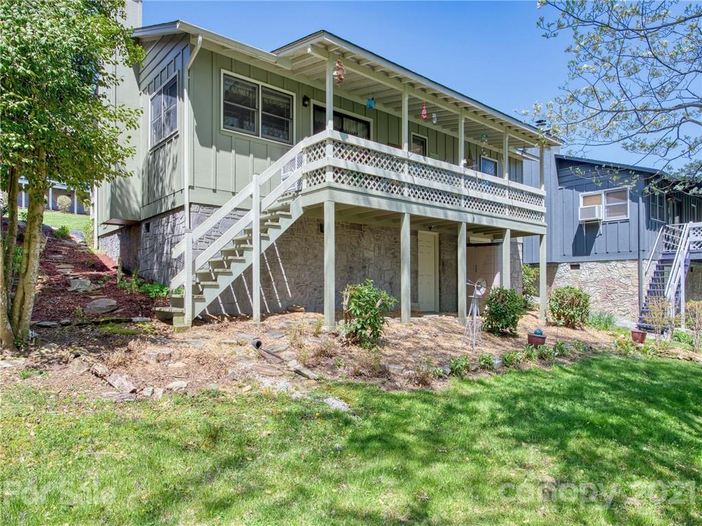 a front view of a house with a garden and porch