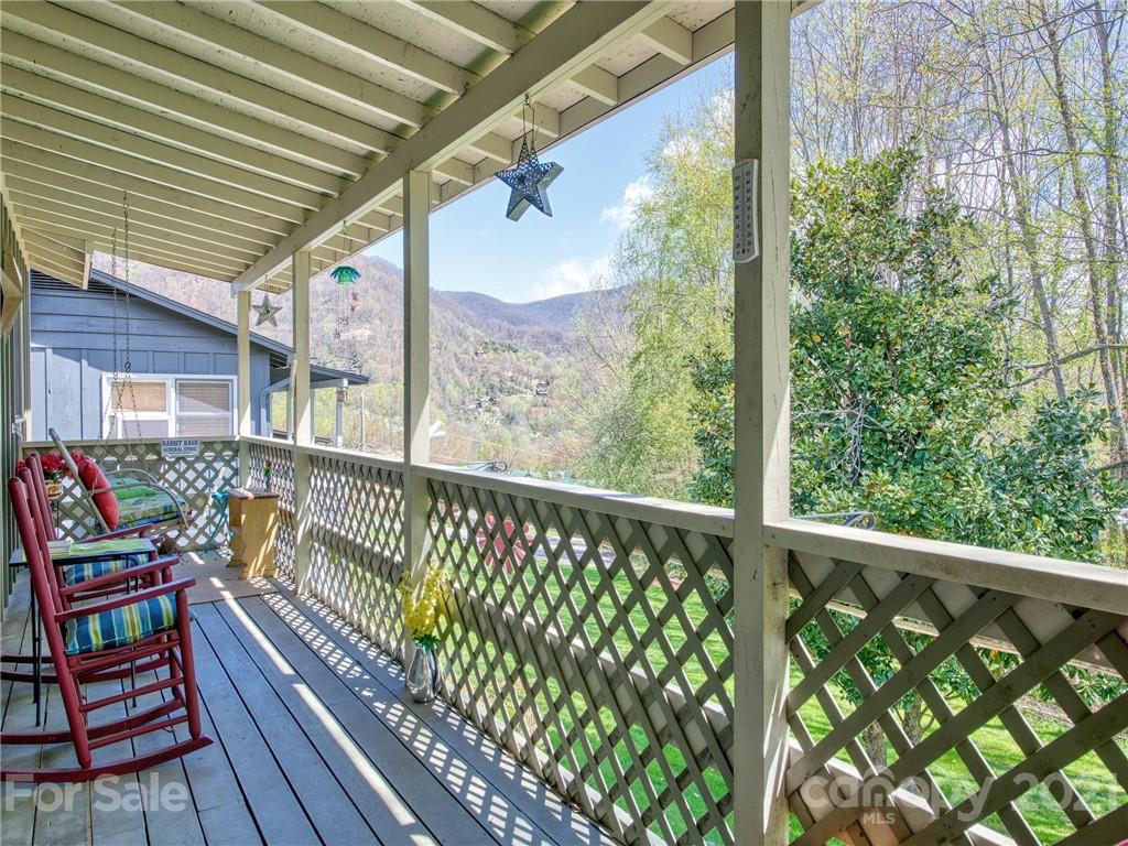 444 Stoney Ridge Loop Maggie Valley, NC 28751 - Photo 3 of 25 a view of a two chairs in the balcony