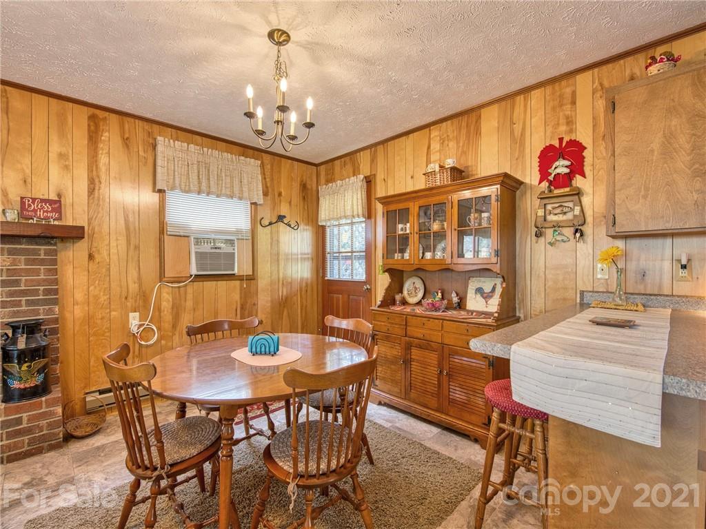 444 Stoney Ridge Loop Maggie Valley, NC 28751 - Photo 10 of 25 a dining room with furniture and window