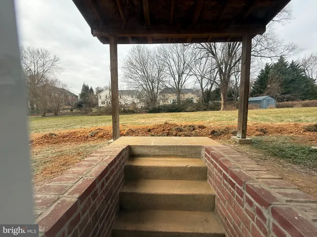 a view of ocean and a yard