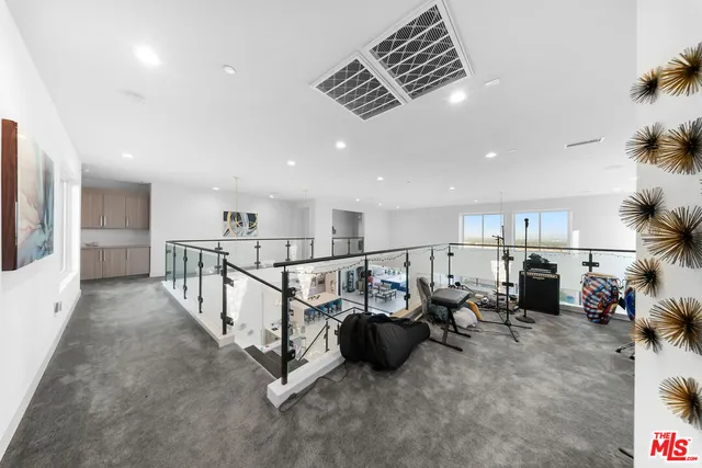 a spacious bedroom with a bed and a couch