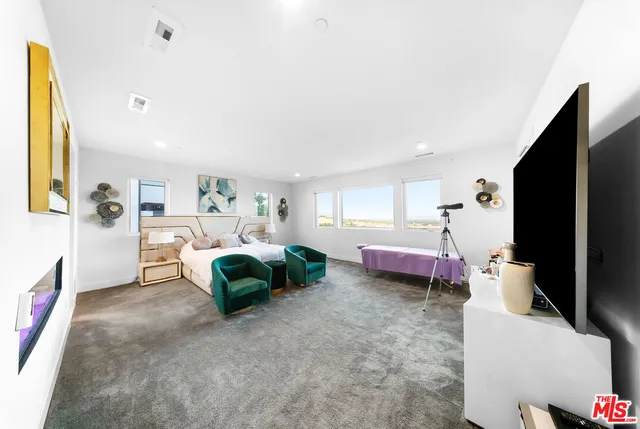 a bathroom with a double vanity sink mirror and bathtub