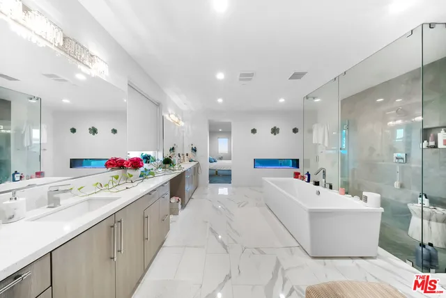 a living room with lots of furniture and a flat screen tv