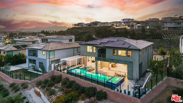 a front view of houses with yard