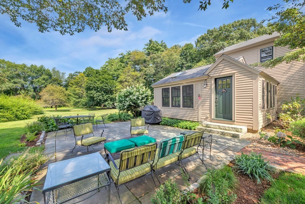 874 Bay Road Hamilton, MA 01982 - Photo 8 of 42 a view of house with backyard and sitting area