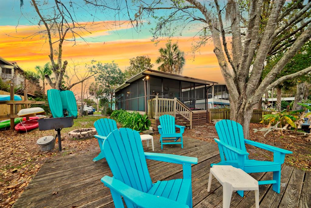 6427 West Richard Drive Weeki Wachee, FL 34607 - Photo 3 of 35 a view of an outdoor sitting area with furniture and wooden floor