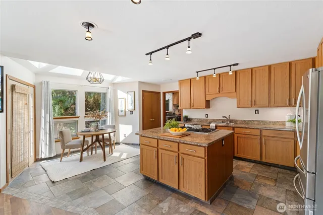a kitchen with a stove top oven sink and cabinets