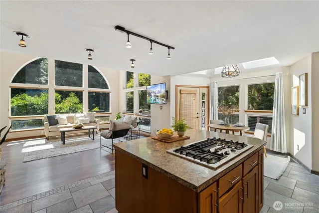 a living room with furniture and large windows