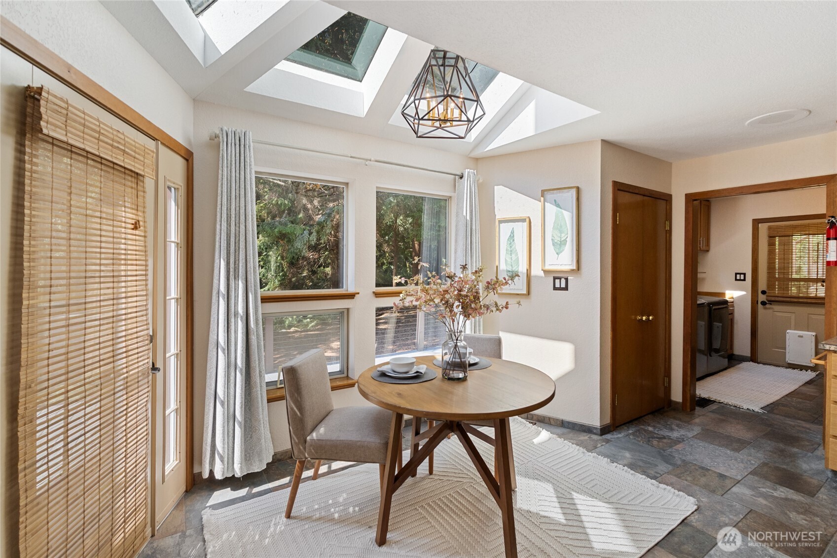 20 Bluebird Lane Port Ludlow, WA 98365 - Photo 15 of 40 a view of a dining room with furniture window and outside view