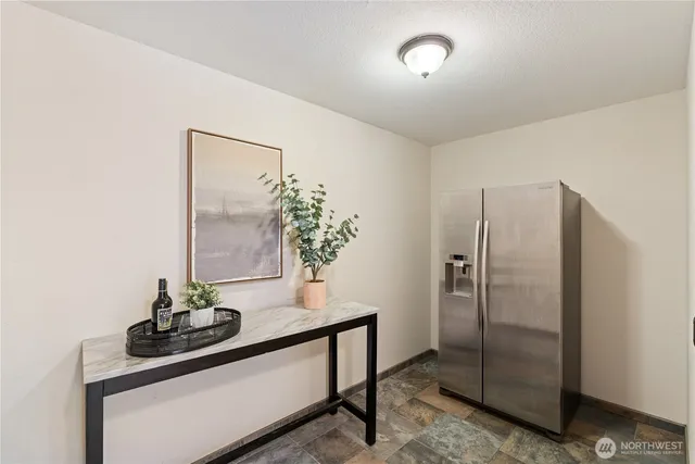 a table with a vase and flowers on it
