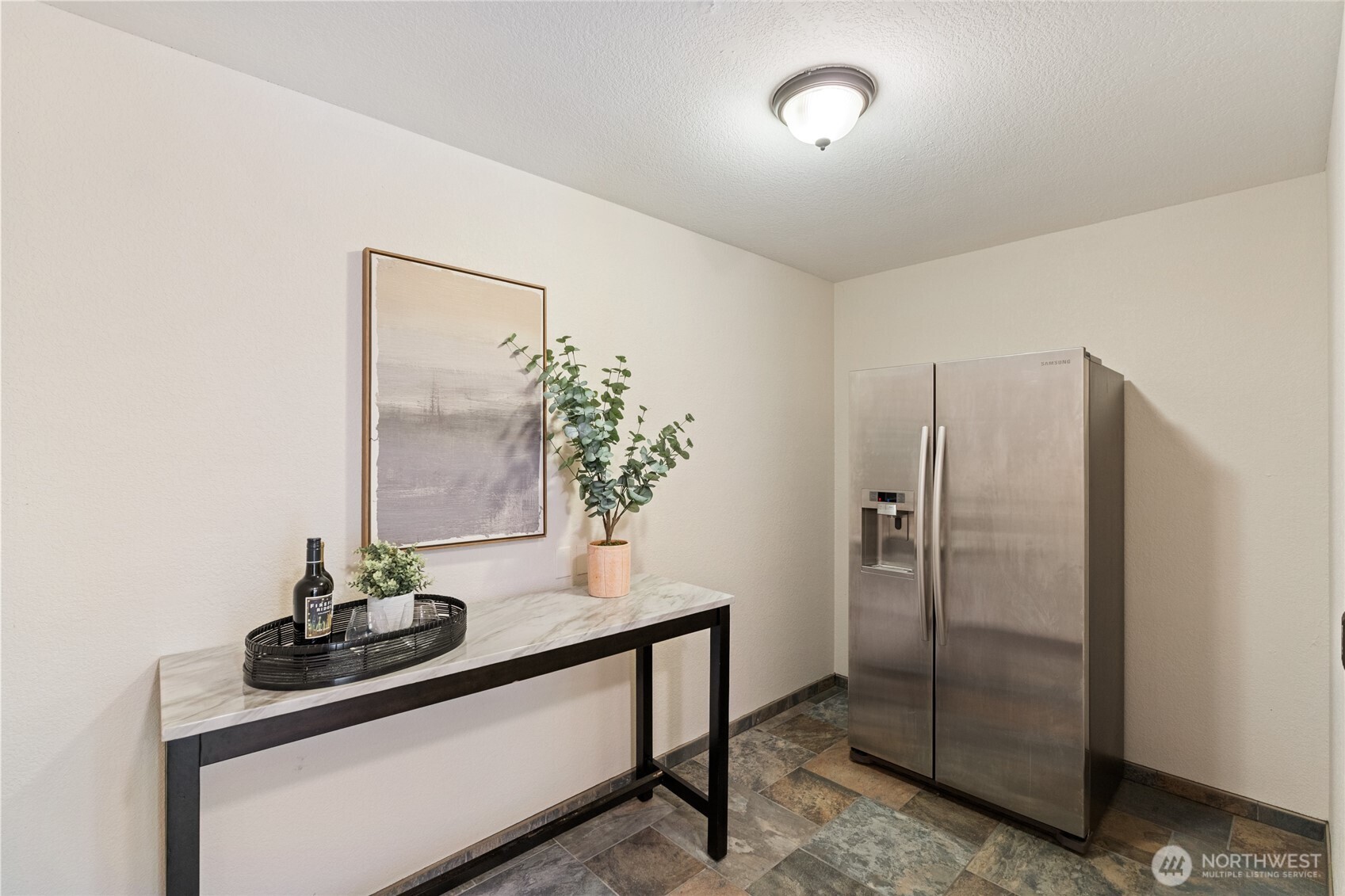 20 Bluebird Lane Port Ludlow, WA 98365 - Photo 18 of 40 a table with a vase and flowers on it