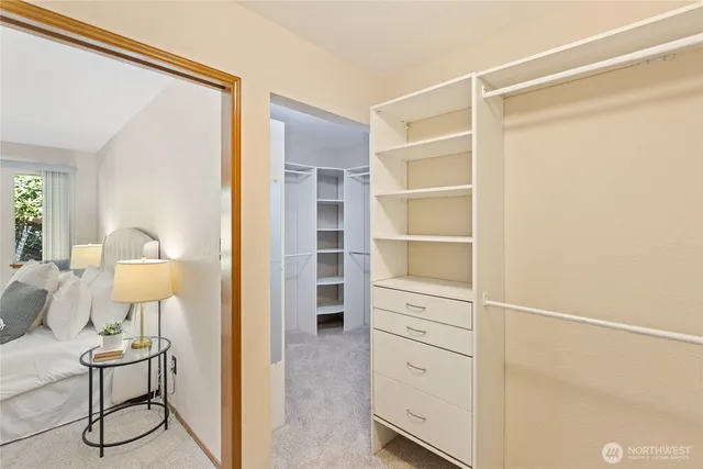 a view of walk in closet with empty racks