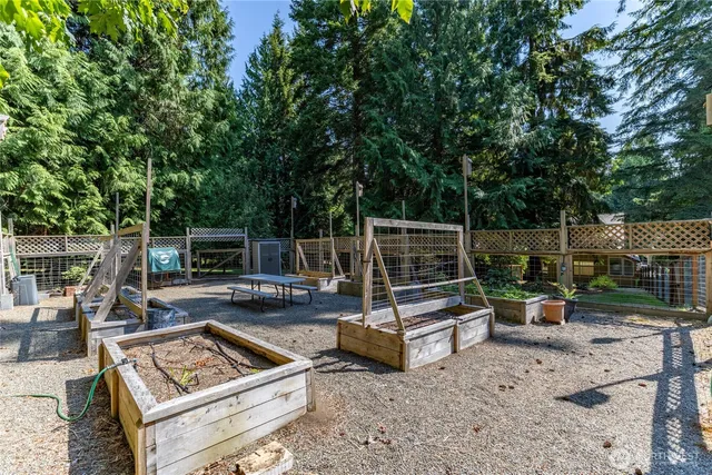 a view of a backyard with sitting area