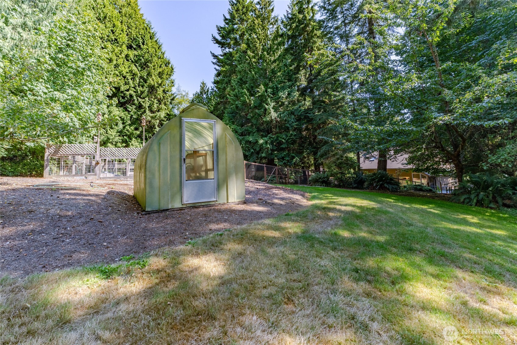 20 Bluebird Lane Port Ludlow, WA 98365 - Photo 7 of 40 a front view of a house with a yard