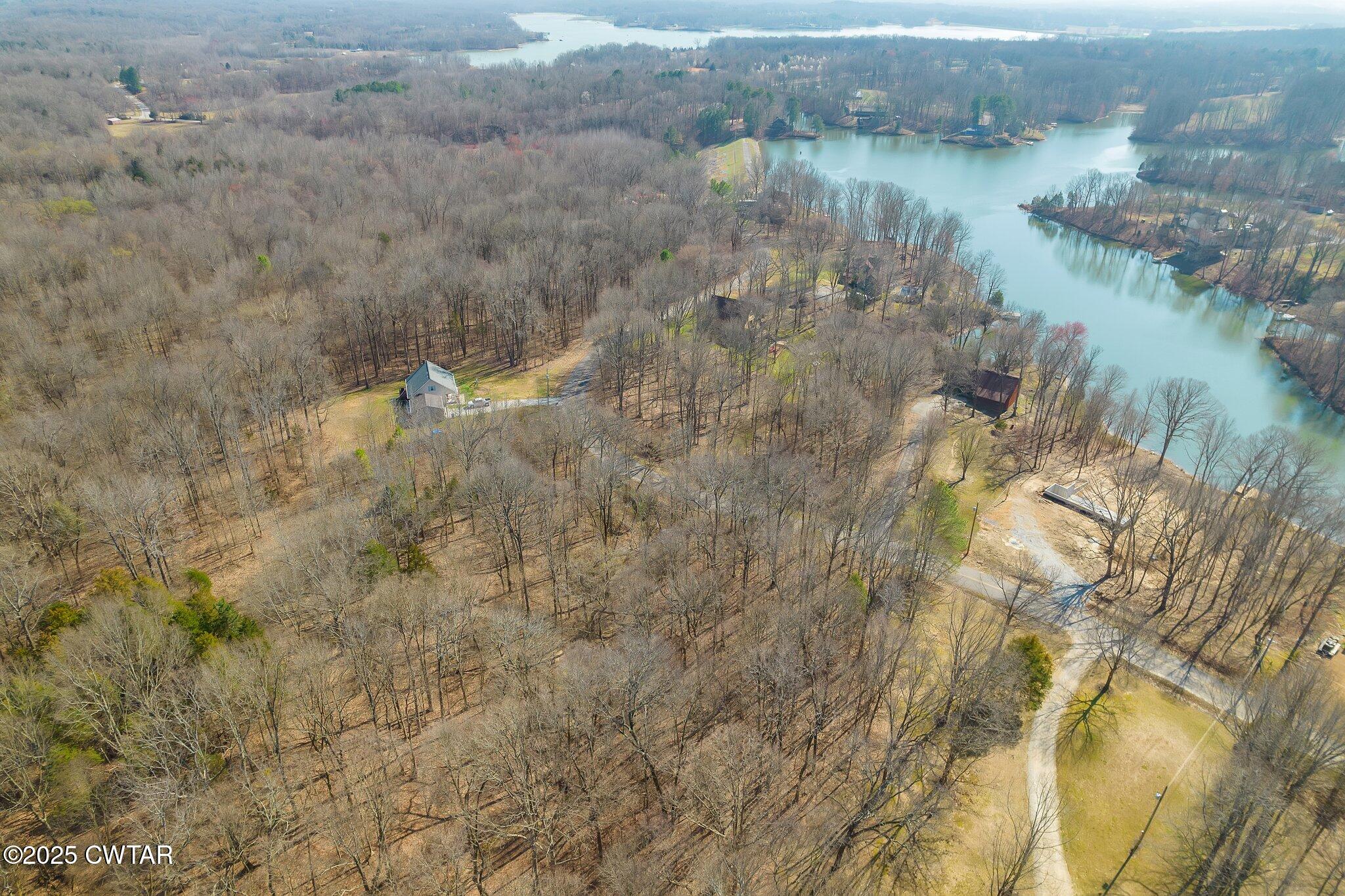42 Lake Hayes Estates Road Trenton, TN 38382 - Photo 14 of 29 a view of a lake from a yard