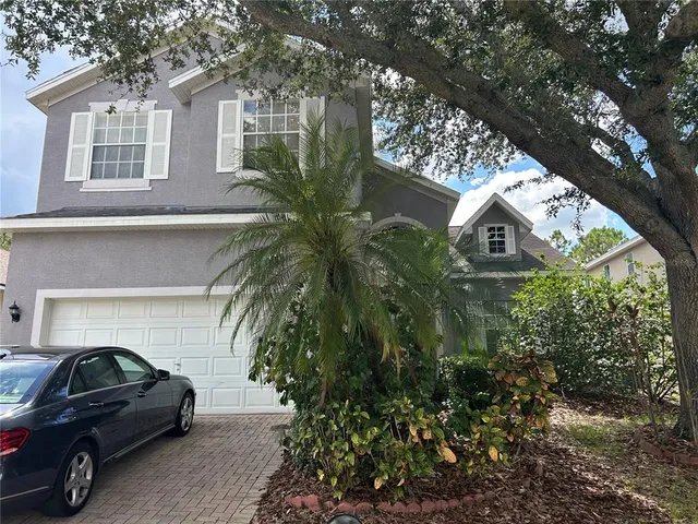 a view of a car parked in front of a house