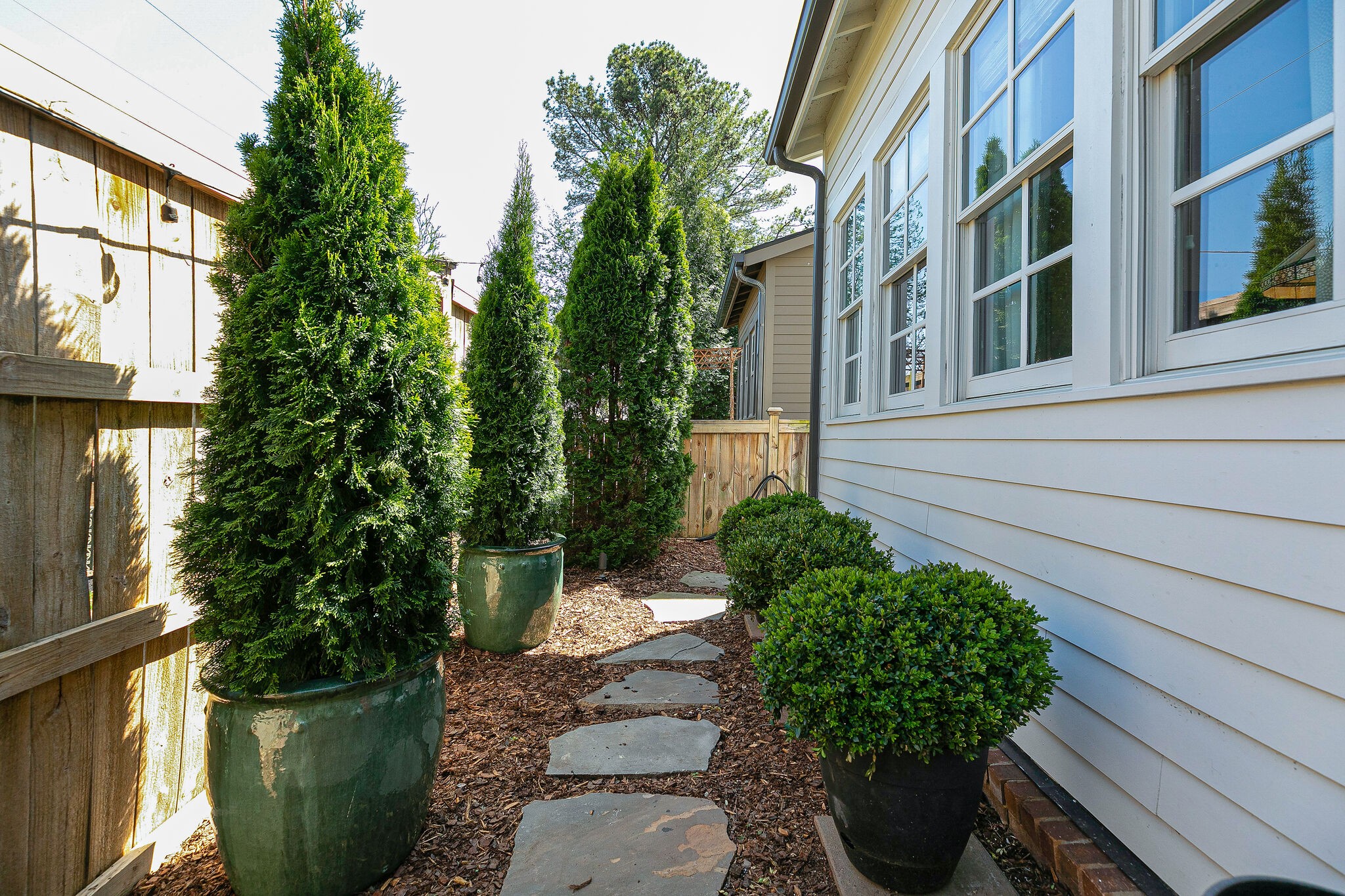 104 Cottage Lane Franklin, TN 37064 - Photo 16 of 19 a potted plant sitting in front of a building