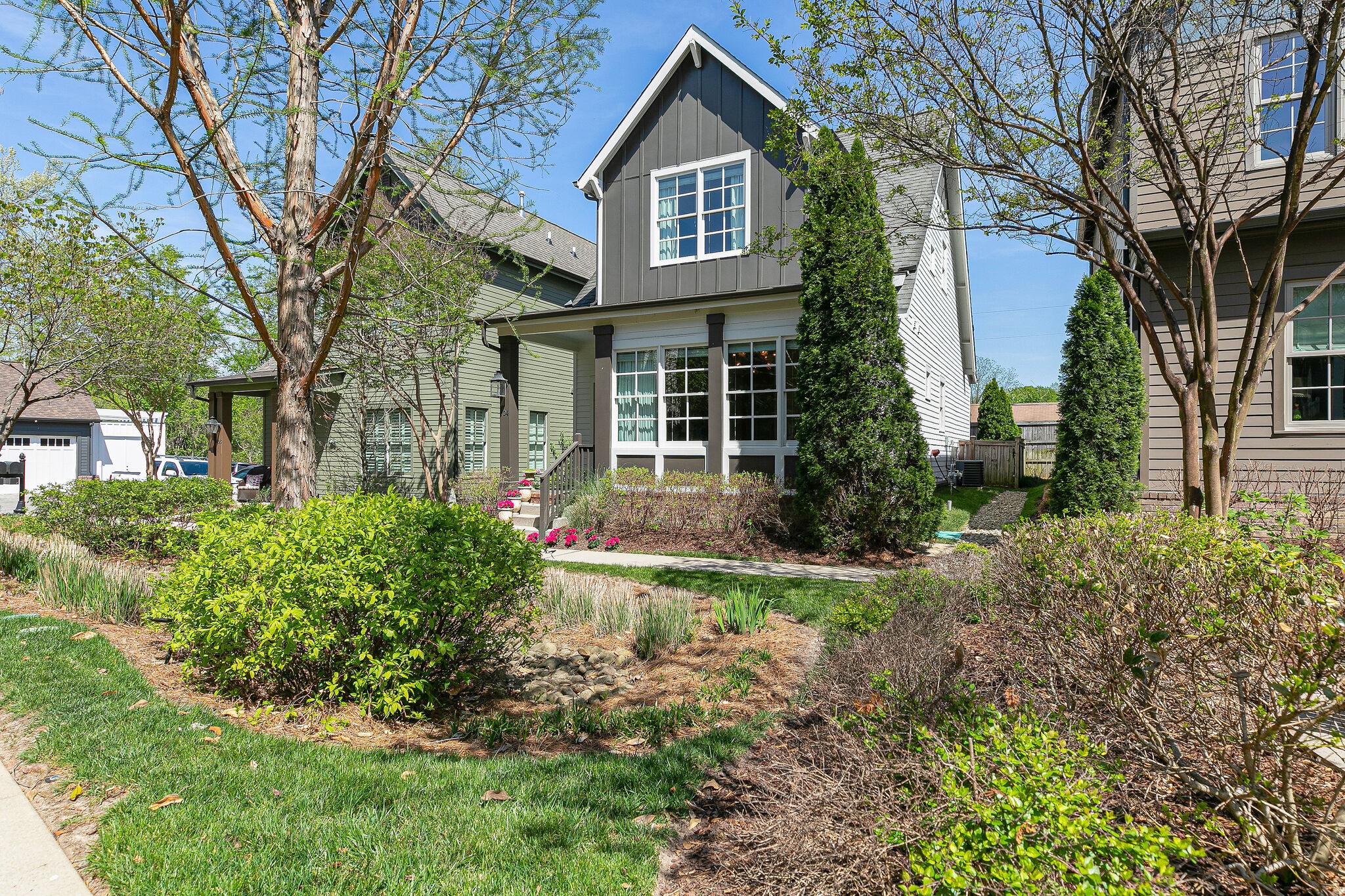 104 Cottage Lane Franklin, TN 37064 - Photo 2 of 19 a front view of a house with garden