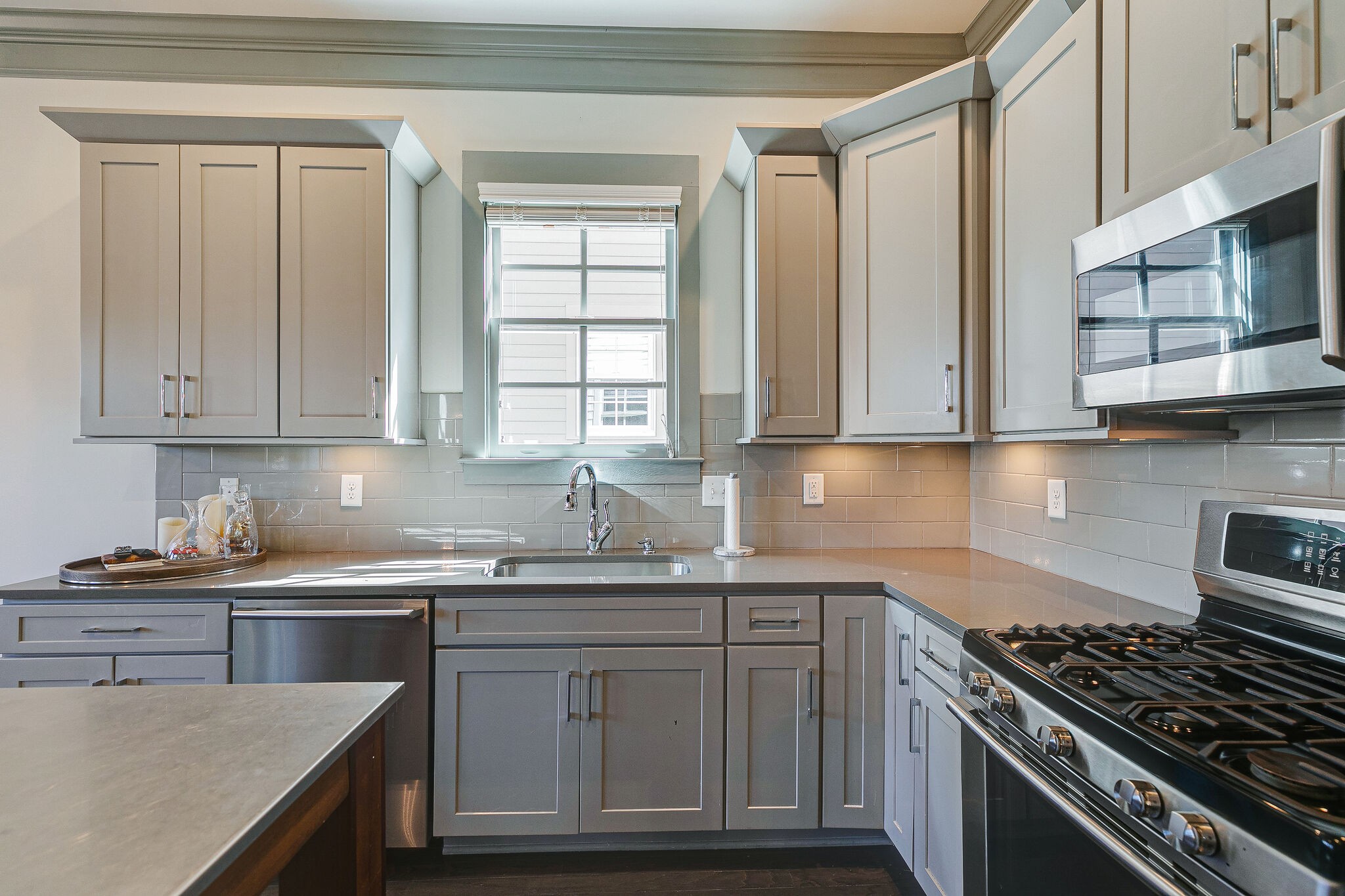 104 Cottage Lane Franklin, TN 37064 - Photo 7 of 19 a kitchen with stainless steel appliances granite countertop a sink stove and cabinets