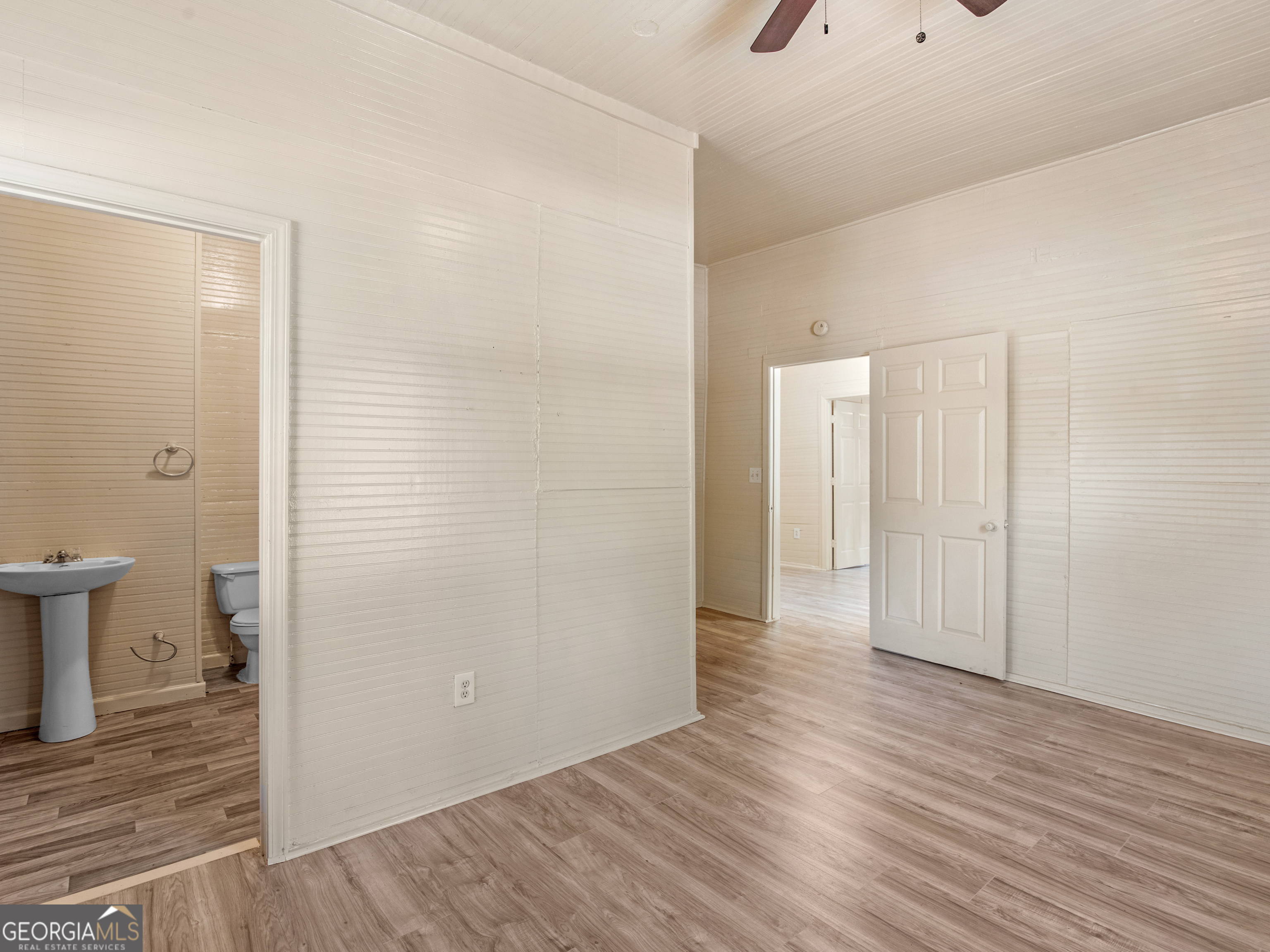 245 Atlanta Street Barnesville, GA 30204 - Photo 13 of 36 a view of a bathroom with wooden floor