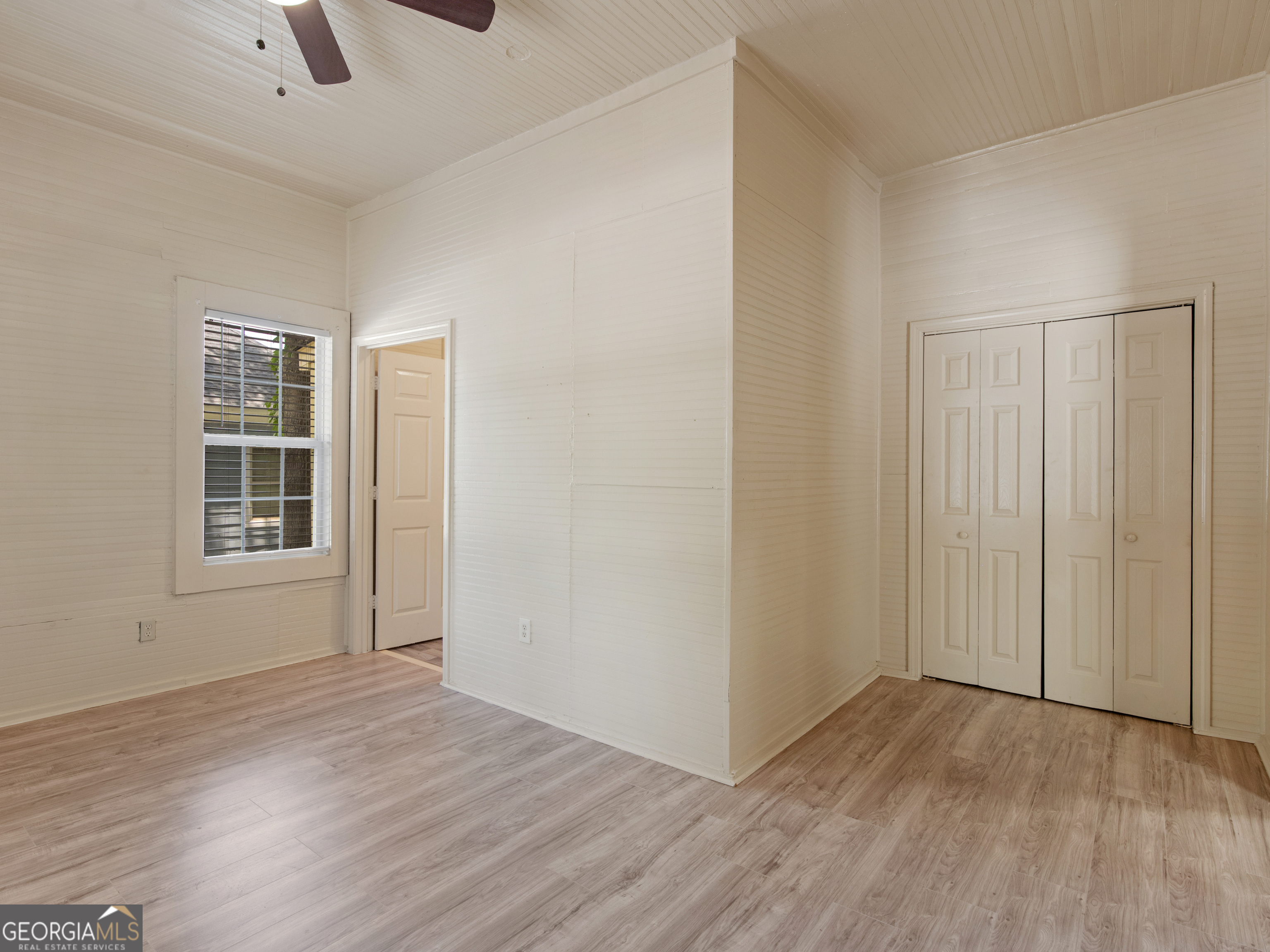 245 Atlanta Street Barnesville, GA 30204 - Photo 14 of 36 an empty room with windows and closet