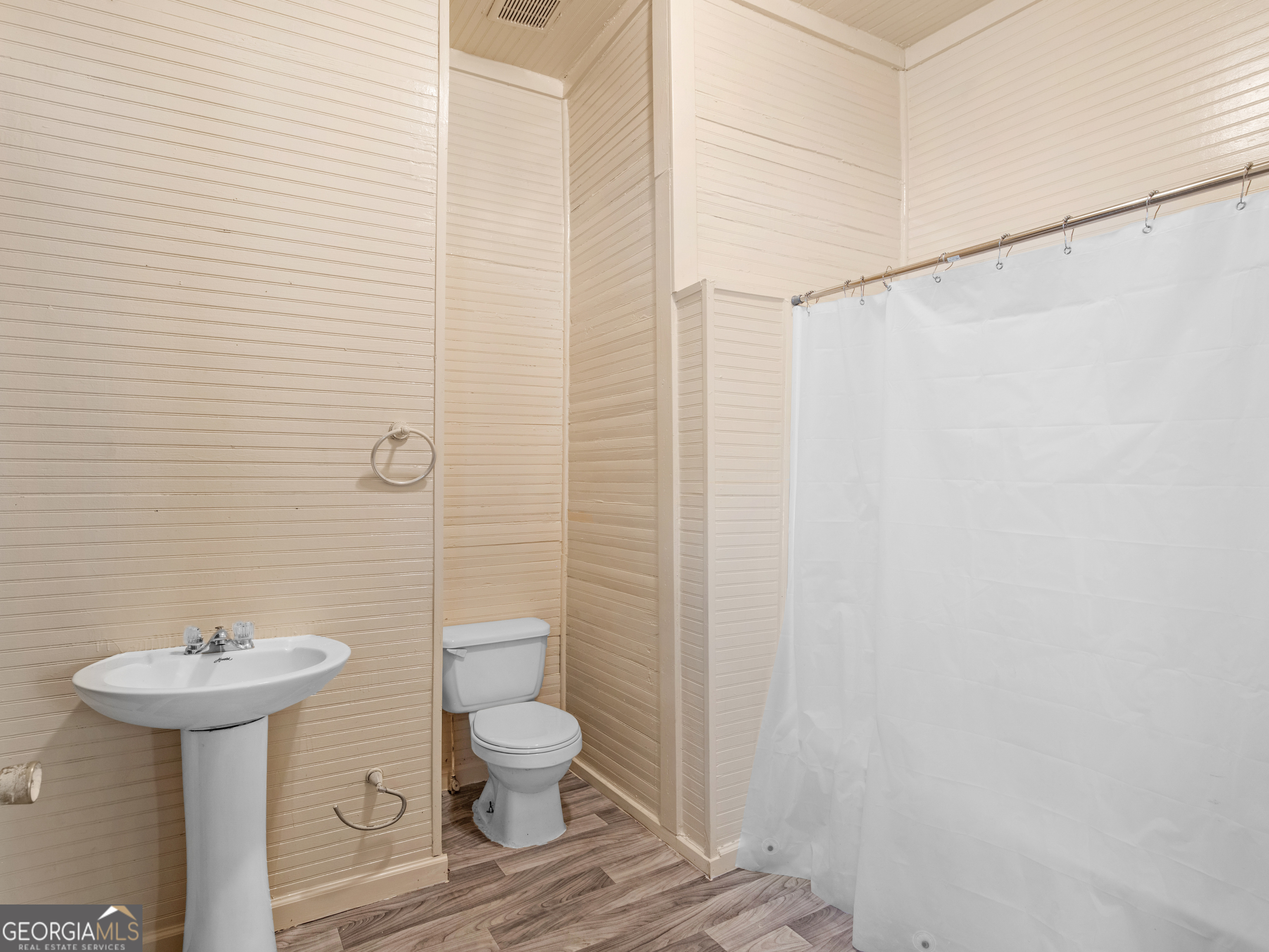 245 Atlanta Street Barnesville, GA 30204 - Photo 15 of 36 a bathroom with a sink toilet and shower
