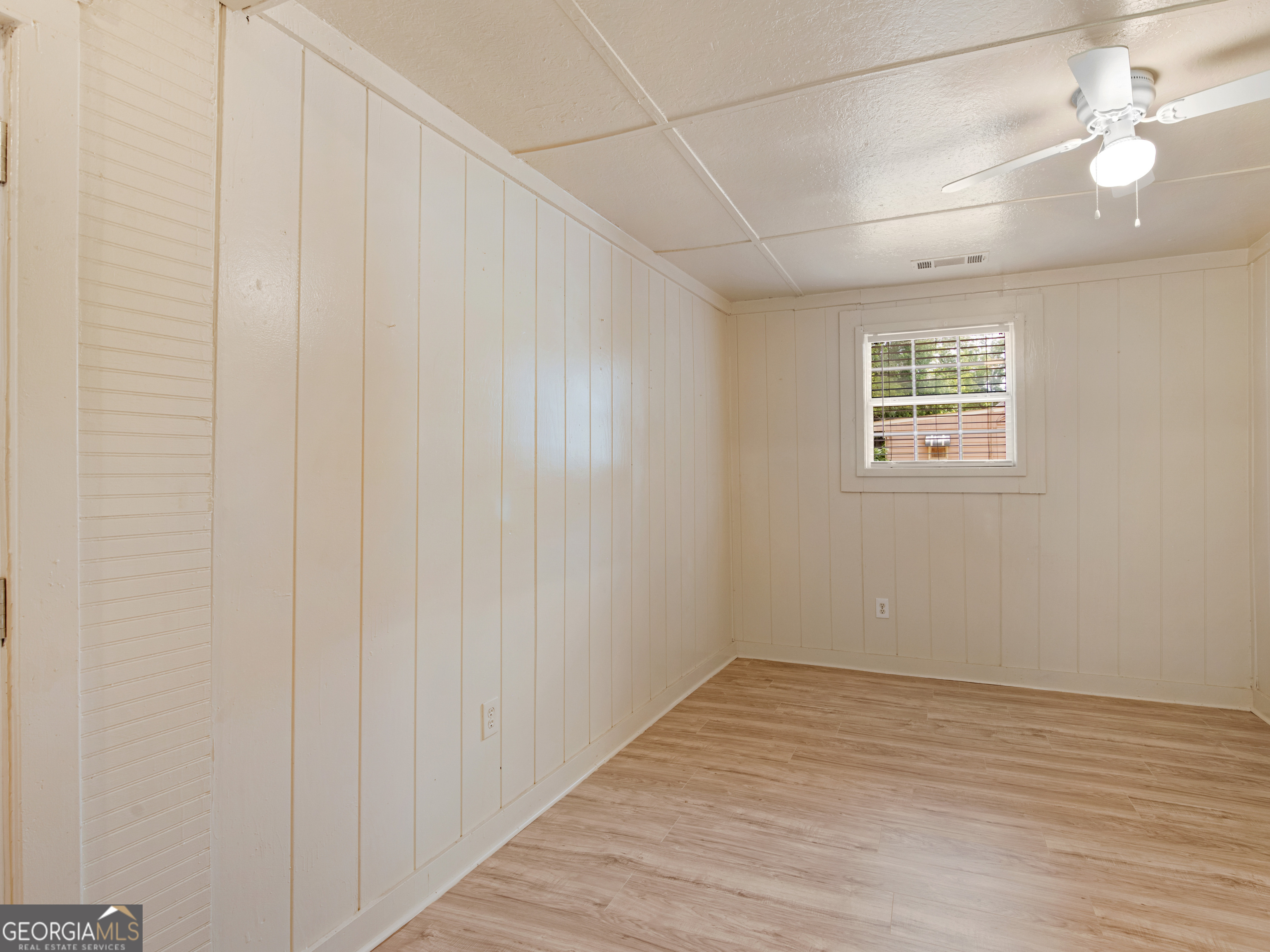 245 Atlanta Street Barnesville, GA 30204 - Photo 20 of 36 wooden floor in an empty room with a window