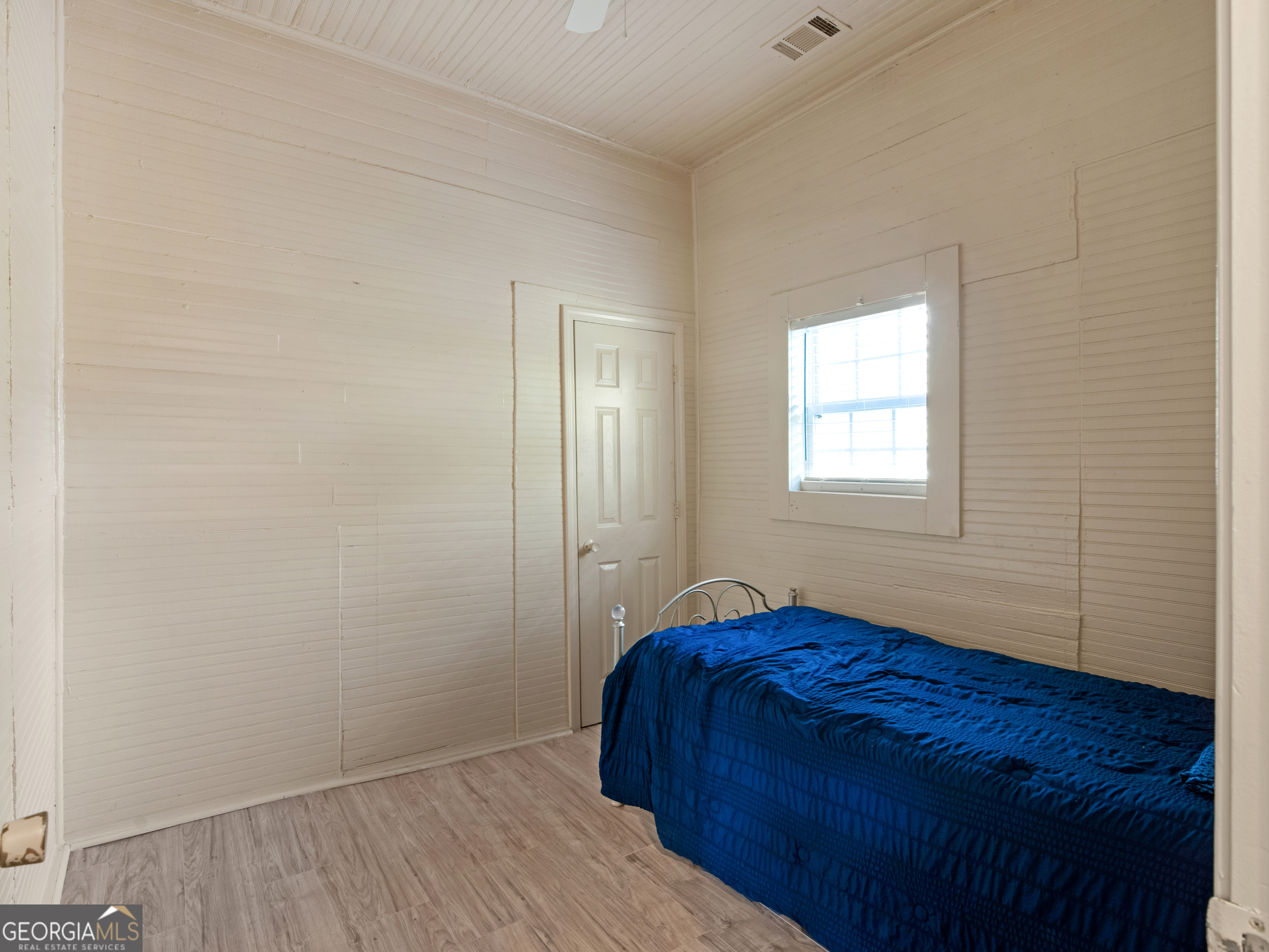 245 Atlanta Street Barnesville, GA 30204 - Photo 27 of 36 a bedroom with a bed and a window
