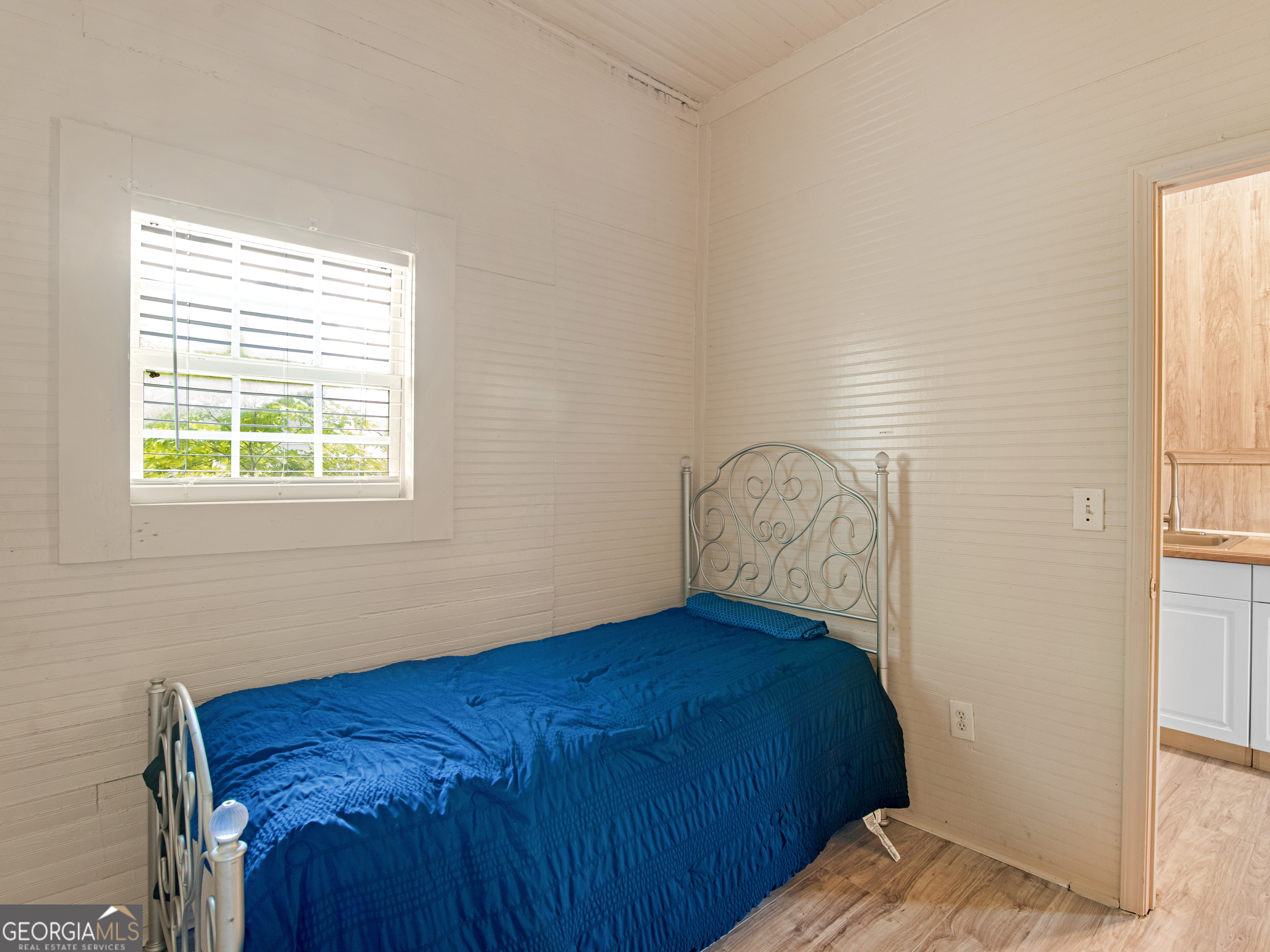 245 Atlanta Street Barnesville, GA 30204 - Photo 28 of 36 a bedroom with a bed window and a window