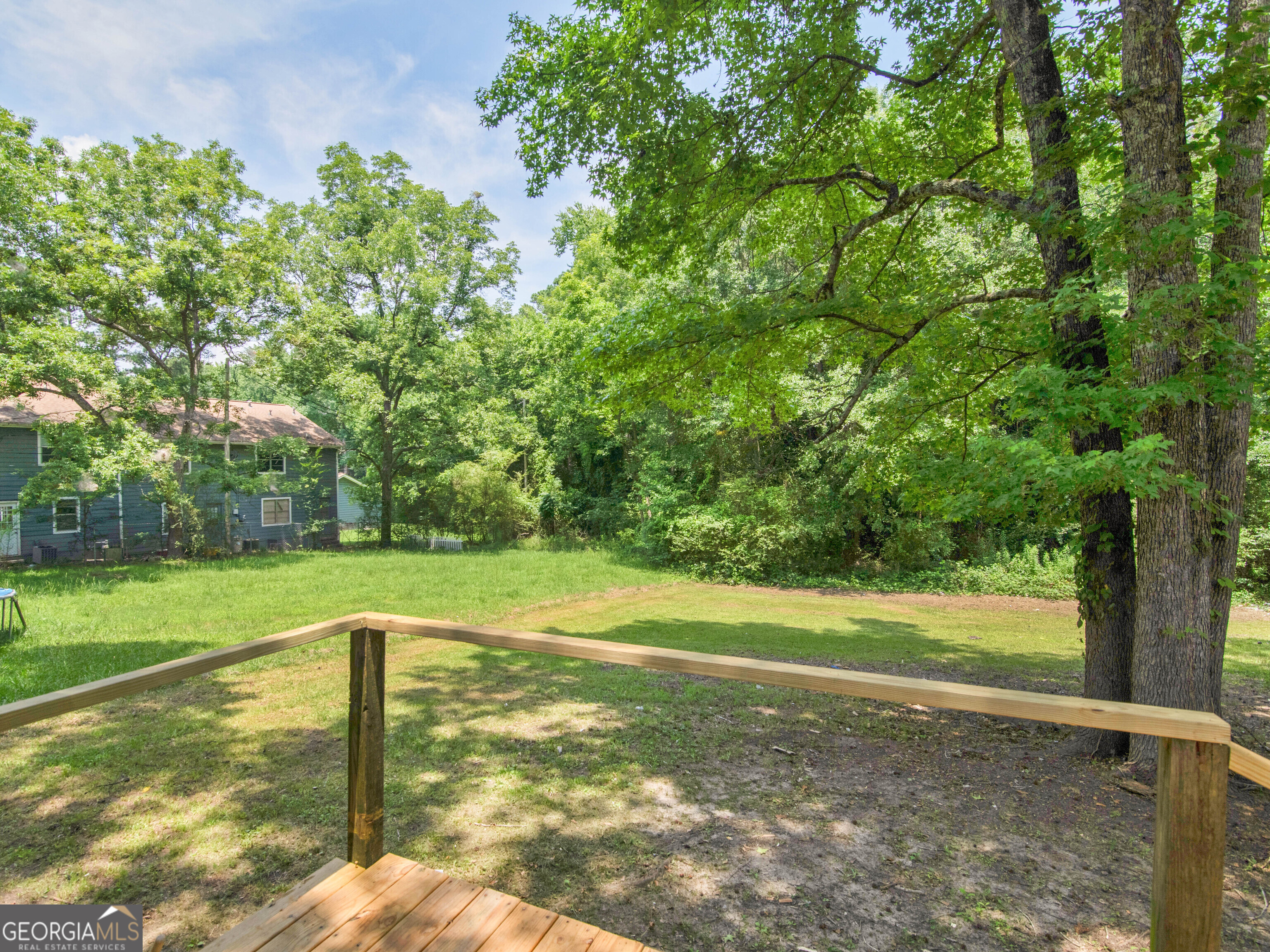 245 Atlanta Street Barnesville, GA 30204 - Photo 31 of 36 a view of a yard with a tree