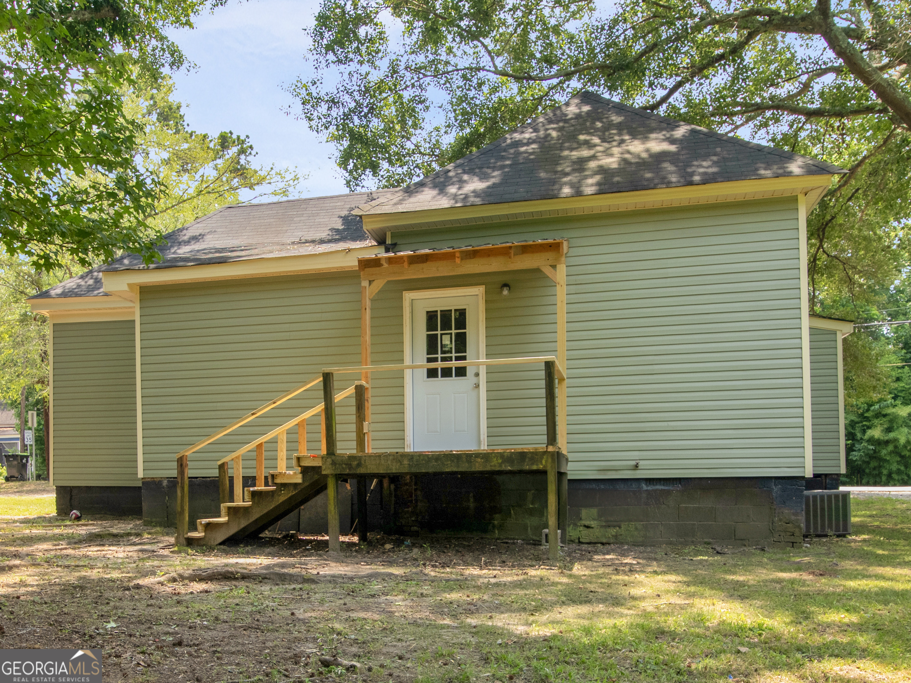 245 Atlanta Street Barnesville, GA 30204 - Photo 32 of 36 a view of a house with a yard