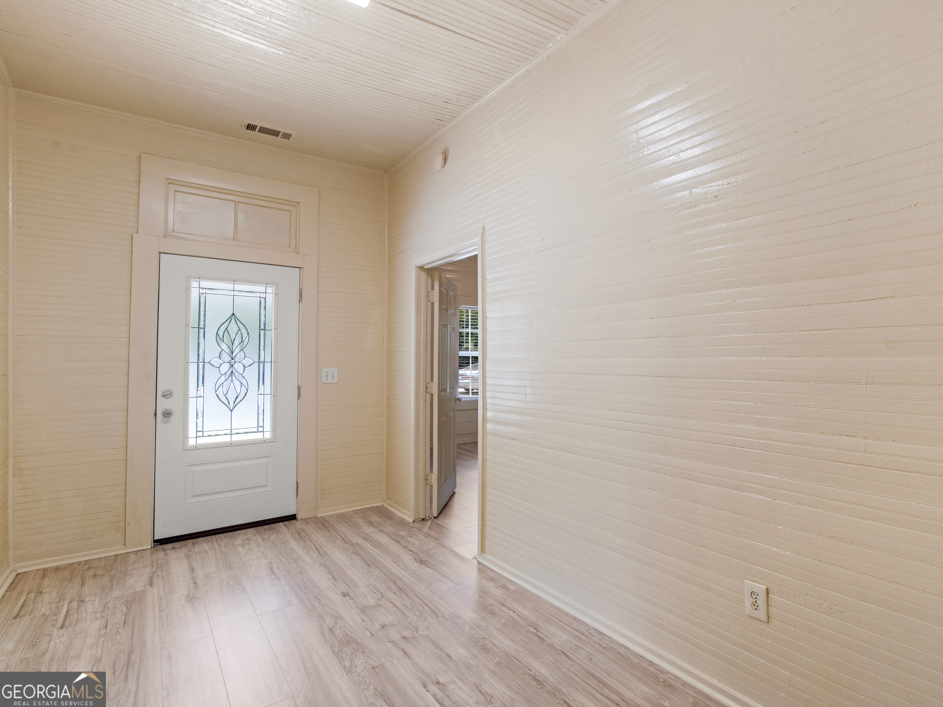 245 Atlanta Street Barnesville, GA 30204 - Photo 5 of 36 an empty room with windows and closet
