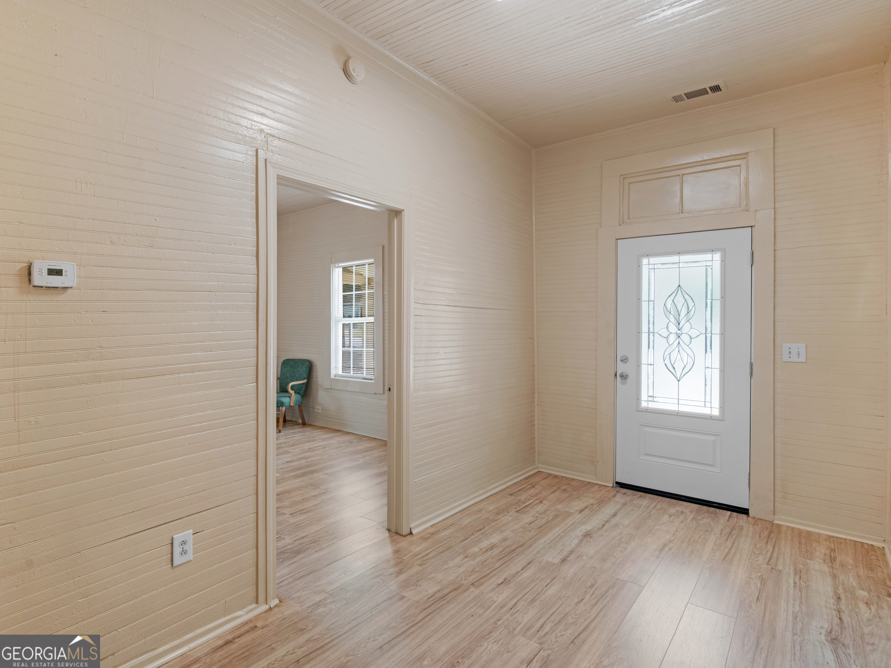 245 Atlanta Street Barnesville, GA 30204 - Photo 6 of 36 a view of a room with wooden floor and windows