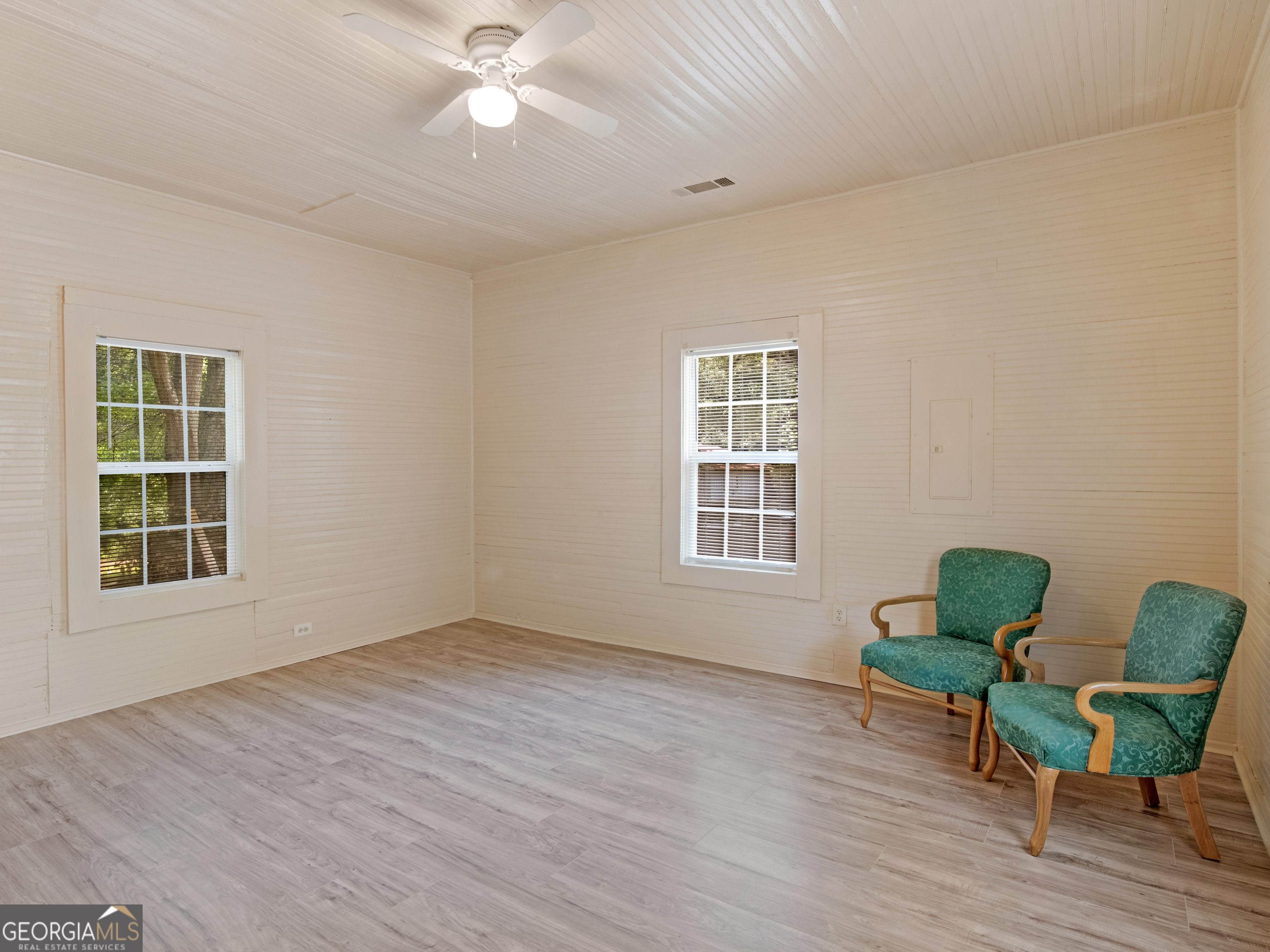 245 Atlanta Street Barnesville, GA 30204 - Photo 7 of 36 a view of workspace with furniture window and wooden floor