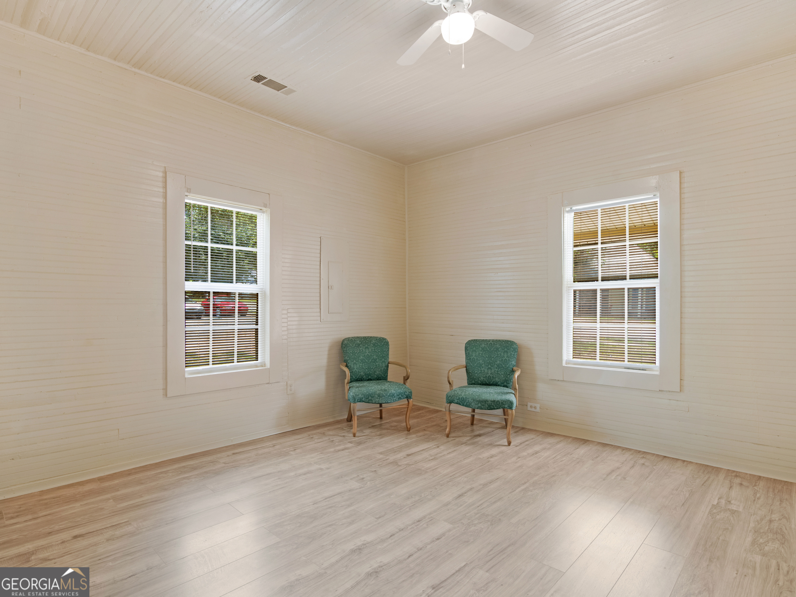 245 Atlanta Street Barnesville, GA 30204 - Photo 10 of 36 a view of a livingroom with wooden furniture and a window